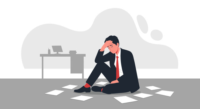 Businessman sitting on floor in office, stressed, overwhelmed with paperwork, feeling defeated