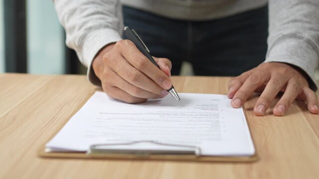 Signing Residential Lease Agreement, Real Estate Contract, Or Legal Document For Property Rental Or Business Deal, Hand, Pen, Paper, Table, Desk