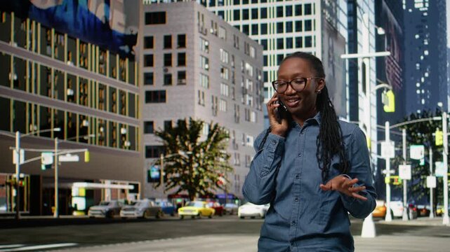 Smiling black woman engaged in phone call on mobile device, strolling through bustling cityscape. Outdoor urban scene captures fashionable pedestrian enjoying casual lifestyle while chatting.