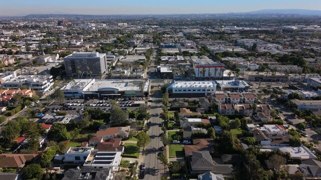 Los Angeles Aerial approach los angeles suburban retail and office core with visible parking, lowrise corporate buildings, surrounding residential blocks and straight avenues 