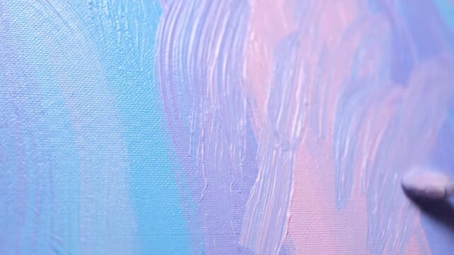 Abstract close-up of paintbrush strokes creating a vibrant, textured surface, with shades of blue and purple