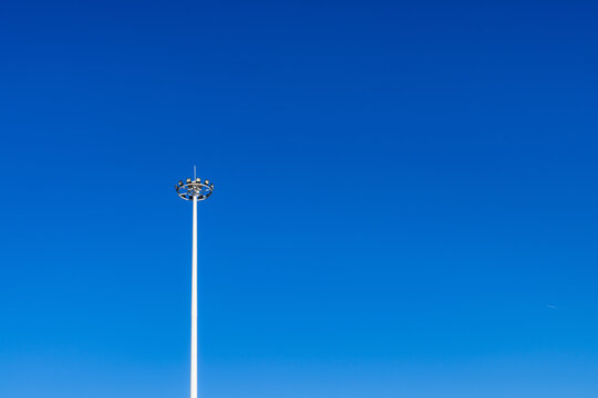 Blue sky and searchlights