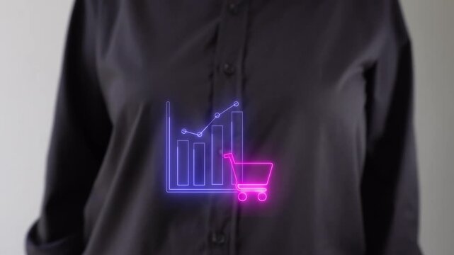 Sales analysis. Businessperson pointing to a virtual icon of a shopping cart on a chart.
