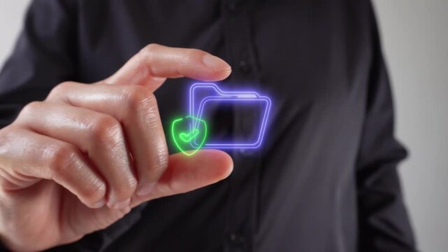 Protected files. A woman's hands holding a virtual folder icon and a shield with a checkmark inside between her two fingers.