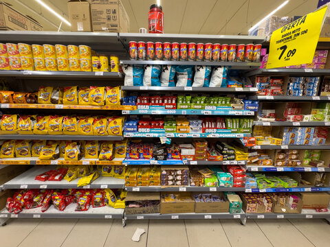 BELO HORIZONTE, MG, BRAZIL, MAY, 10, 2026 A well-stocked grocery store shelf filled with various colorful snack foods and products