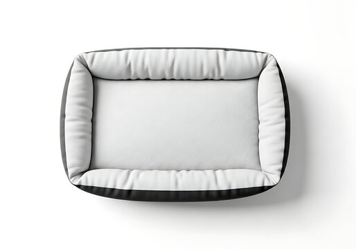 Isolated rectangular pet bed with plush white cushion and dark border, overhead view for dog or cat comfort accessory