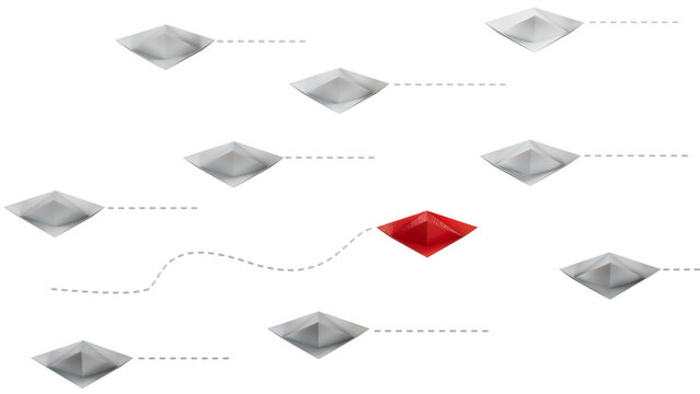 Think different - individuality concept. Individual and unique leader red paper boat flies to the side.Supports PNG files with transparent backgrounds.