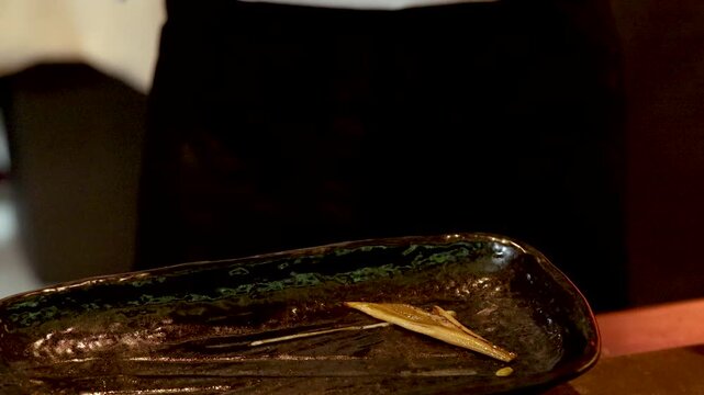 Sushi Chef Searing Anago Eel with a Blowtorch Flame