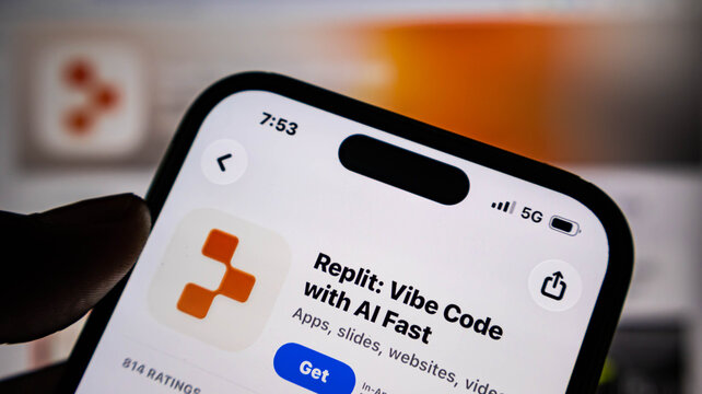 Closeup of a smartphone screen displaying the replit app store page with ai coding features
