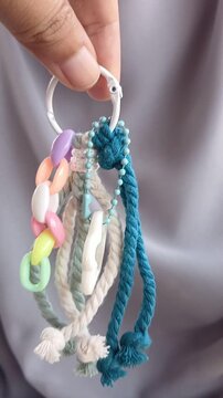 woman holding a colorful chains