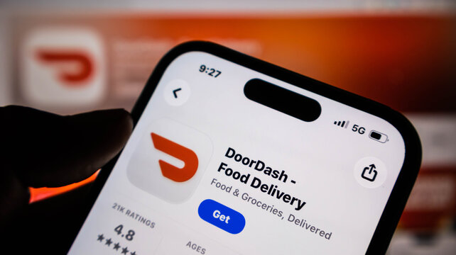 Closeup of a smartphone screen displaying the doordash food delivery app store page