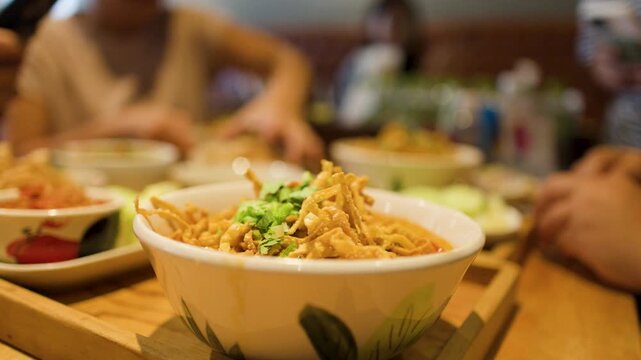 Northern Thai Khao Soi Curry Noodle Soup in a Ceramic Bowl