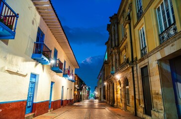 Fototapeta premium Traditional Colonial Architecture in the Historic Central District of La Candelaria of Bogota, Colombia at night
