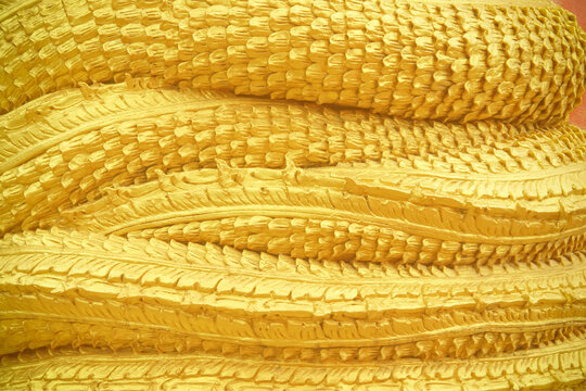 Colorful gold yellow naga scale patterns on background
