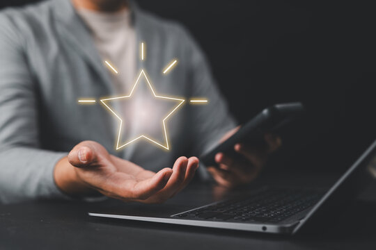 Glowing star hovering above hand, representing loyalty rewards, redeem points, cashback, vouchers, coupons, bonus benefits, and customer engagement success.