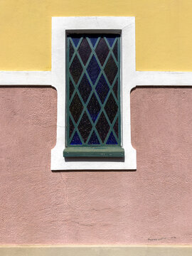 Colorful Traditional Architecture with Stained Glass Window and Stucco Wall
