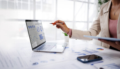 Businesswoman or accountant conducting an analysis of financial reports on a laptop, emphasizing the utilization of digital tools for data interpretation and informed decision-making.  © groviapoto