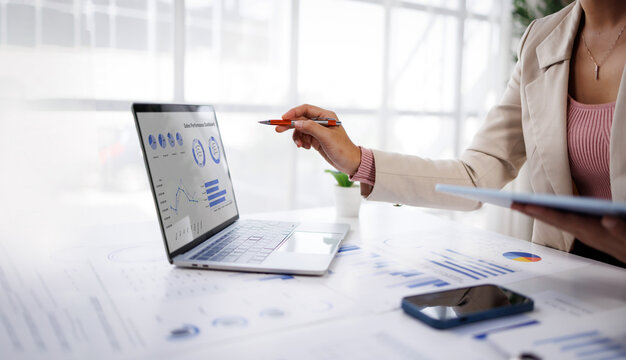 Businesswoman or accountant conducting an analysis of financial reports on a laptop, emphasizing the utilization of digital tools for data interpretation and informed decision-making.
