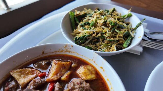 Traditional Indonesian Food Beef and Vegetable Stew With Coconut Urap