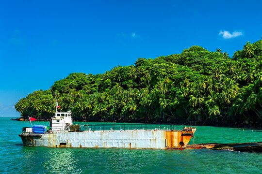 Dredging boat at Ile Royale, the Salvation Islands in French Guiana, South America