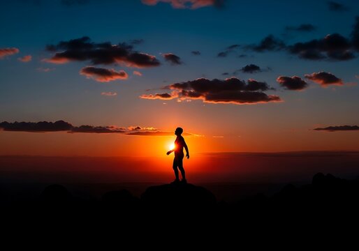 Silhouette of Person Standing on Beach at Sunset.