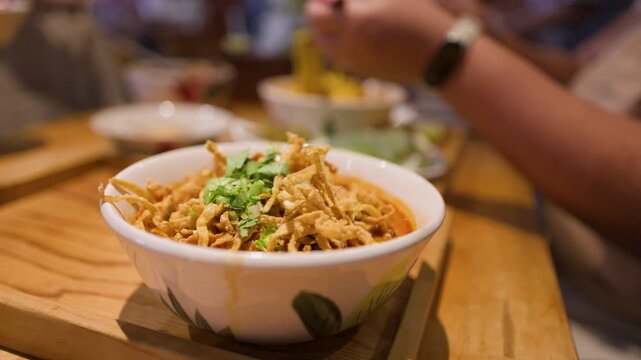 Northern Thai Khao Soi Curry Noodles Served in a Ceramic Bowl