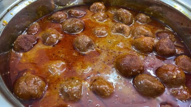 A beautifully presented serving of delicious veg manchurian dumplings, showcasing popular Indo-Chinese fusion and traditional kofta menu trends at a grand Indian marriage feast.