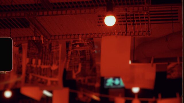 Photography darkroom developing process with red safelight
