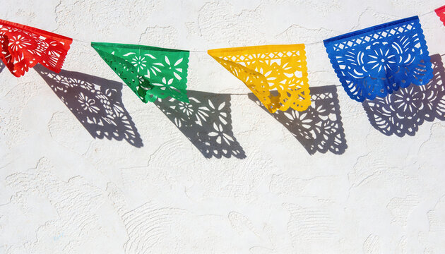 Modern colorful papel picado flags create festive Cinco de Mayo mockup with bright red green yellow and blue decorations