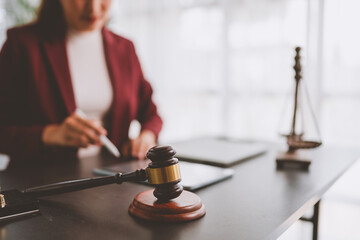 Obraz premium Legal professional working on documents with justice symbols