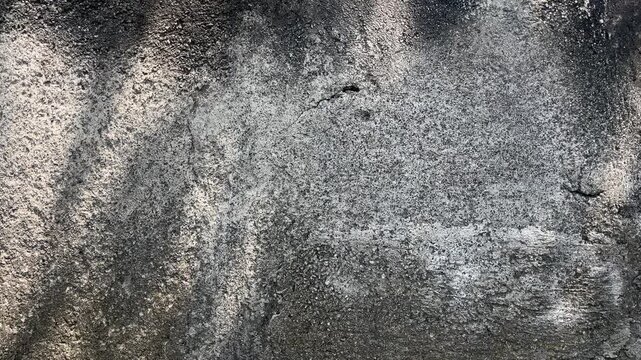 Texture concrete wall of light grey color cement texture background.Grey pastel rough crack cement texture stone concrete,rock plastered stucco wall; painted flat fade background. Side view. close up.