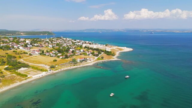 Seddulbahir, Eceabat, Turkey. Sedd el Bahr Fortress, 17th-century Ottoman stone ramparts and angular bastions, aerial drone view over the Dardanelles Strait on a clear sunny day. Aerial View