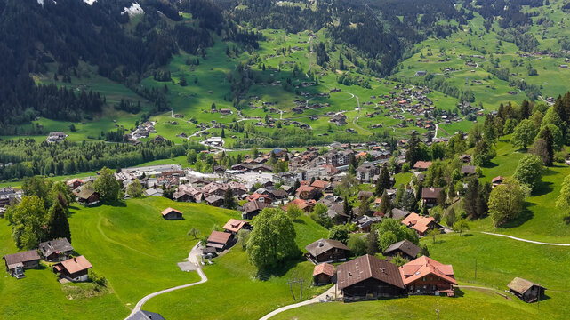 Grindelwald village nestled in vast Swiss Alps valley