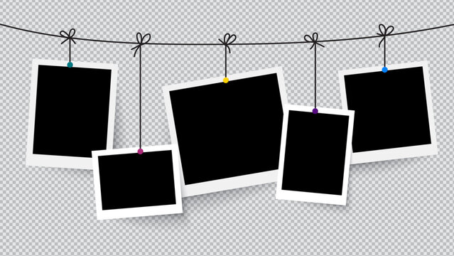 Blank photo frames and empty vintage Polaroid prints hanging on a rustic rope clothesline