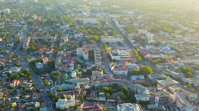 Simferopol, Crimea. Council of Ministers building, neoclassical government complex at the heart of Lenin Square, aerial panoramic view at sunset. Drone footage