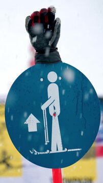 Ski lift instruction sign indicating proper body position during ascent at mountain winter resort.