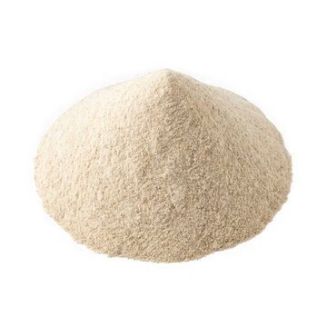 Close-up of coarse whole grain flour in white bowl on plain background
