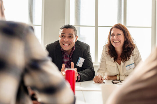 Business meeting with smiling professionals.