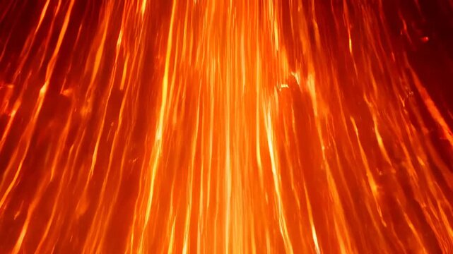 Orange fire light texture smoke abstract glow heat blur motion flame ember inferno dark background vivid red orange molten hot energy dramatic pattern vertical streak firelight soot motion blur