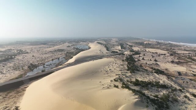 Nhan Duc Sand Dunes, Hoan Lao, Quang Tri (Quang Binh), Vietnam: 4K aerial drone footage of golden sand dunes, wind patterns, desert-like landscape and natural formations
