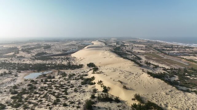 Nhan Duc Sand Dunes, Hoan Lao, Quang Tri (Quang Binh), Vietnam: 4K aerial drone footage of golden sand dunes, wind patterns, desert-like landscape and natural formations