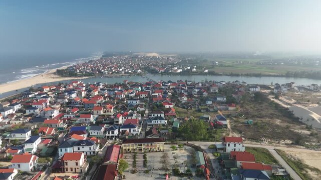 Nam Trach, Quang Binh (Quang Tri), Vietnam &ndash; 4K aerial drone footage of river mouth, East Sea, sandy beach, fishing village, boats, beachfront roads and seaside landscape near Dong Hoi City