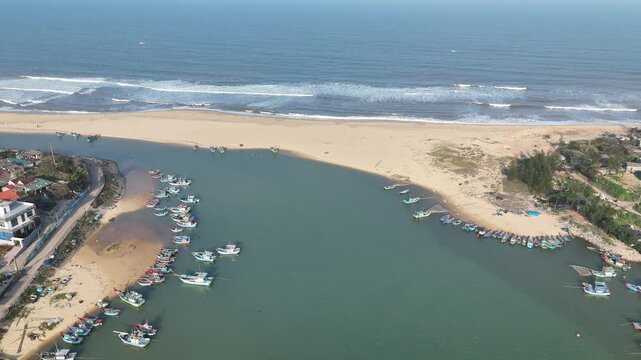 Nam Trach, Quang Binh (Quang Tri), Vietnam &ndash; 4K aerial drone footage of river mouth, East Sea, sandy beach, fishing village, boats, beachfront roads and seaside landscape near Dong Hoi City