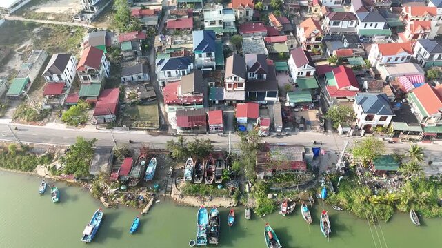 Nam Trach, Quang Binh (Quang Tri), Vietnam &ndash; 4K aerial drone footage of river mouth, East Sea, sandy beach, fishing village, boats, beachfront roads and seaside landscape near Dong Hoi City