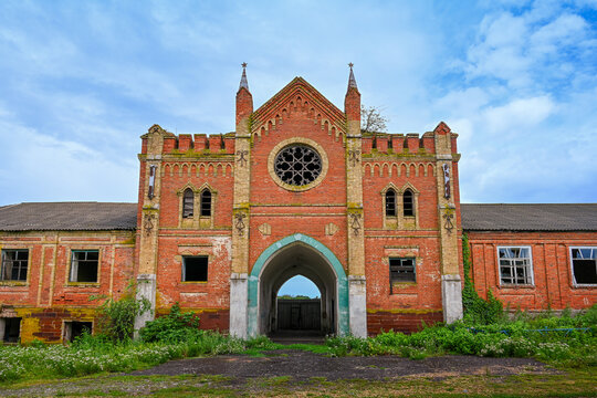 Entrance arch of the abandoned Okhotnikov Castle in the Gothic style, Oryol region of Russia