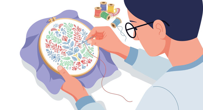Person meticulously embroidering a floral pattern on fabric hoop.