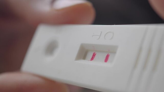 Pregnancy test shows two lines indicating a positive result