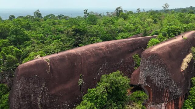 Pan aerial view of iconic whale-shaped sandstone formations, Three Whale Rocks in Thailand.