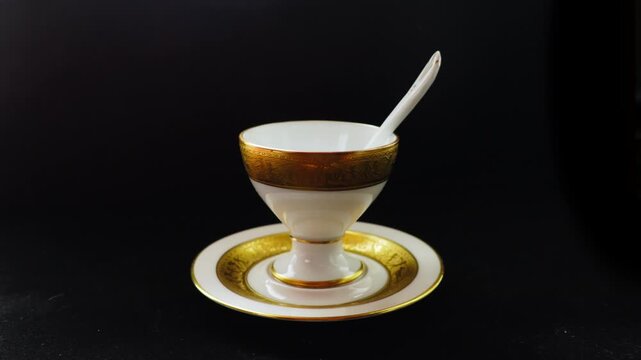 A refined white glove presentation of gold plated dinnerware creates a cinematic moment of luxury and exclusivity, ideal for hospitality, premium service, and high-end brand storytelling.