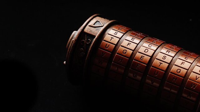 Cinematic close-up of a rotating cryptex against a dark background. This atmospheric clip implies espionage and investigation, perfect for mystery, thriller, or historical discovery themes.